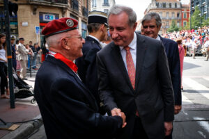 France, Toulouse, 2018-07-14. Toulouse mayor talking with a red beret retired during the celebration of the 14 of july, 