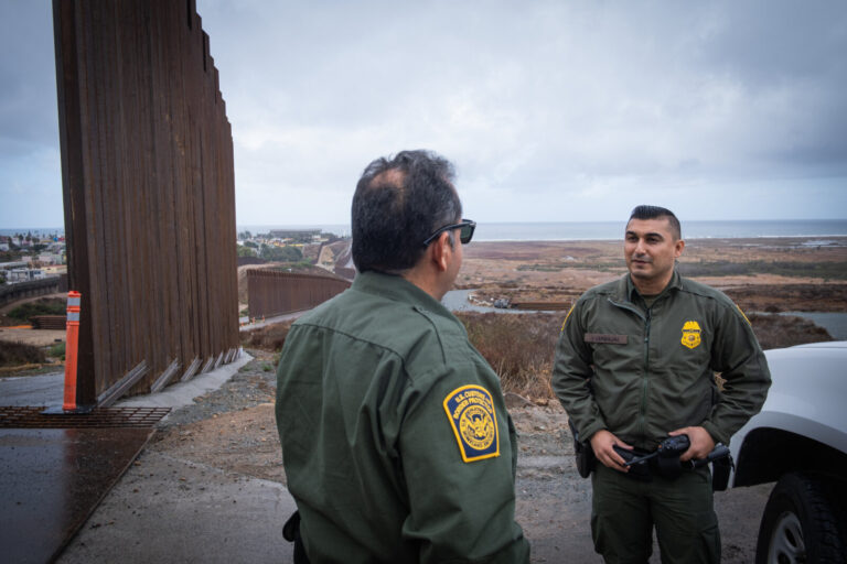 USA, San Diego, 2019-11-20. Border Patrol agent patrols along a section of the U.S.-Mexico border fence. Photograph by F