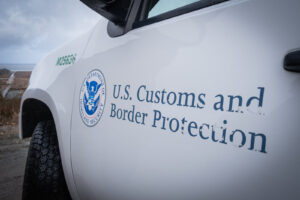 USA, San Diego, 2019-11-20. Border Patrol agent patrols along a section of the U.S.-Mexico border fence. Photograph by F