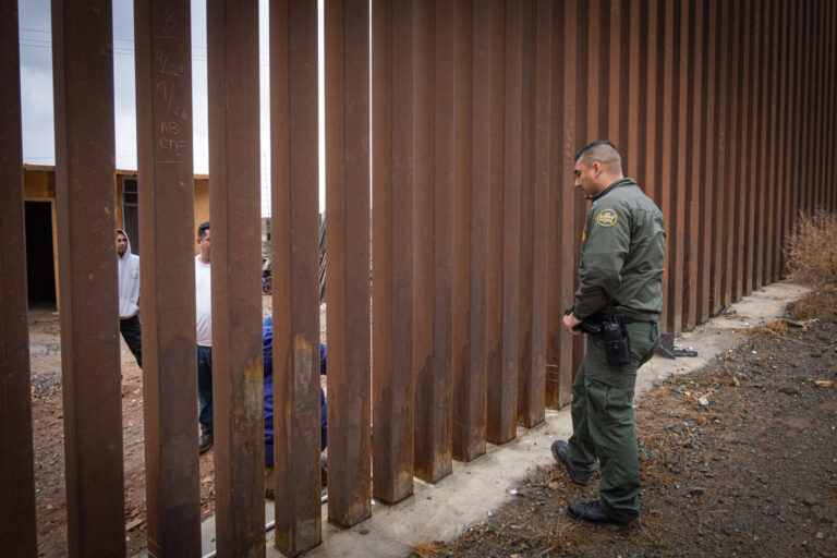 USA, San Diego, 2019-11-20. Border Patrol agent patrols along a section of the U.S.-Mexico border fence. Photograph by F