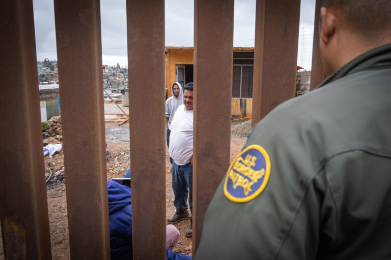 USA, San Diego, 2019-11-20. Border Patrol agent patrols along a section of the U.S.-Mexico border fence. Photograph by F