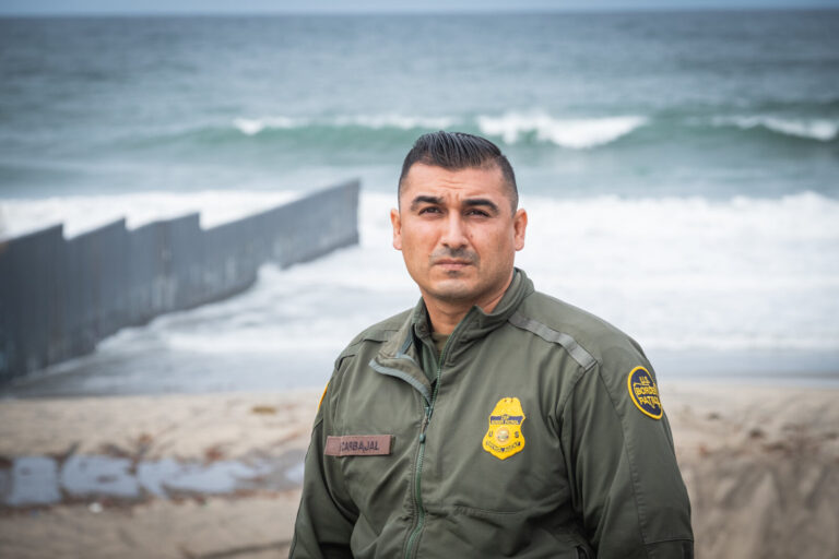 USA, San Diego, 2019-11-20. Border Patrol agent patrols along a section of the U.S.-Mexico border fence. Photograph by F