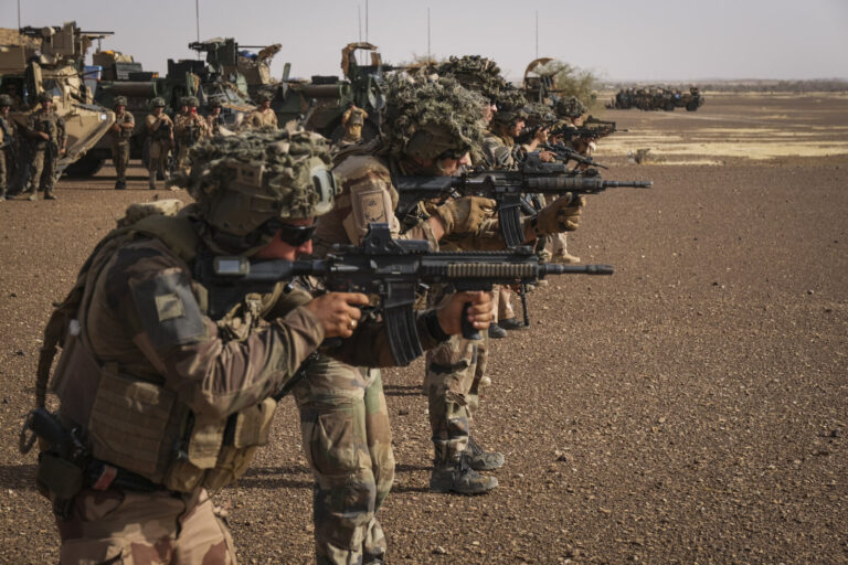 Burkina Faso, april 2021. French army soldiers shoot with guns into Sahel desert during barkhane operation.Burkina Faso
