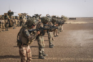 Burkina Faso, april 2021. French army soldiers shoot with guns into Sahel desert during barkhane operation.
Burkina Faso