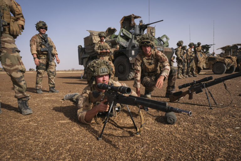 Burkina Faso, april 2021. French army soldiers shoot with guns into Sahel desert during barkhane operation.Burkina Faso