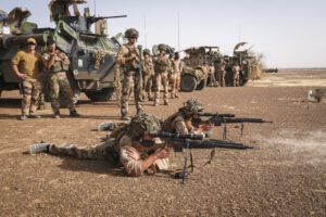 Burkina Faso, april 2021. French army soldiers shoot with guns into Sahel desert during barkhane operation.
Burkina Faso