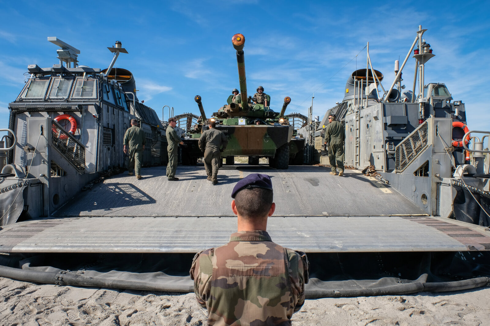 USA, Jacksonville, 2017-10-21. A french soldier with a tank behind him getting ready for the Amphibious Bold Alligator E