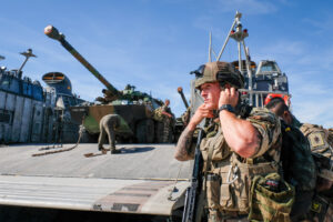 USA, Jacksonville, 2017-10-21. A french soldier with a tank behind him getting ready for the Amphibious Bold Alligator E