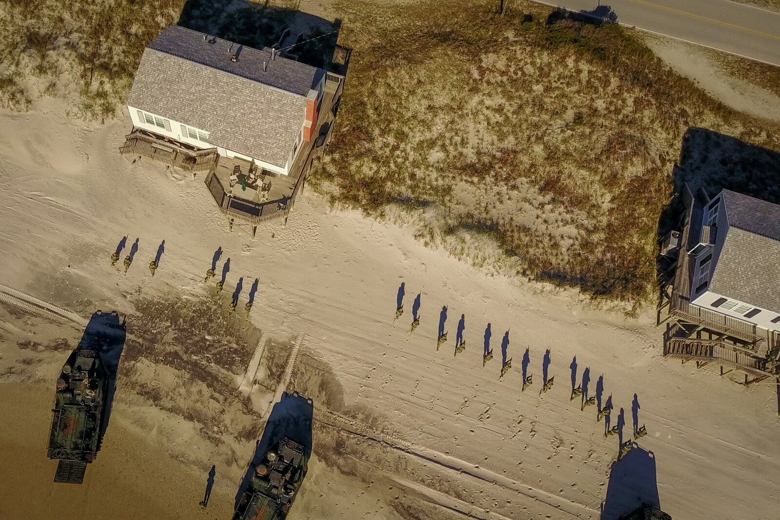 USA, Jacksonville, 2017-10-26. US Navy amphibious vehicles on the beach and mexican soldiers during the Amphibious Bold 