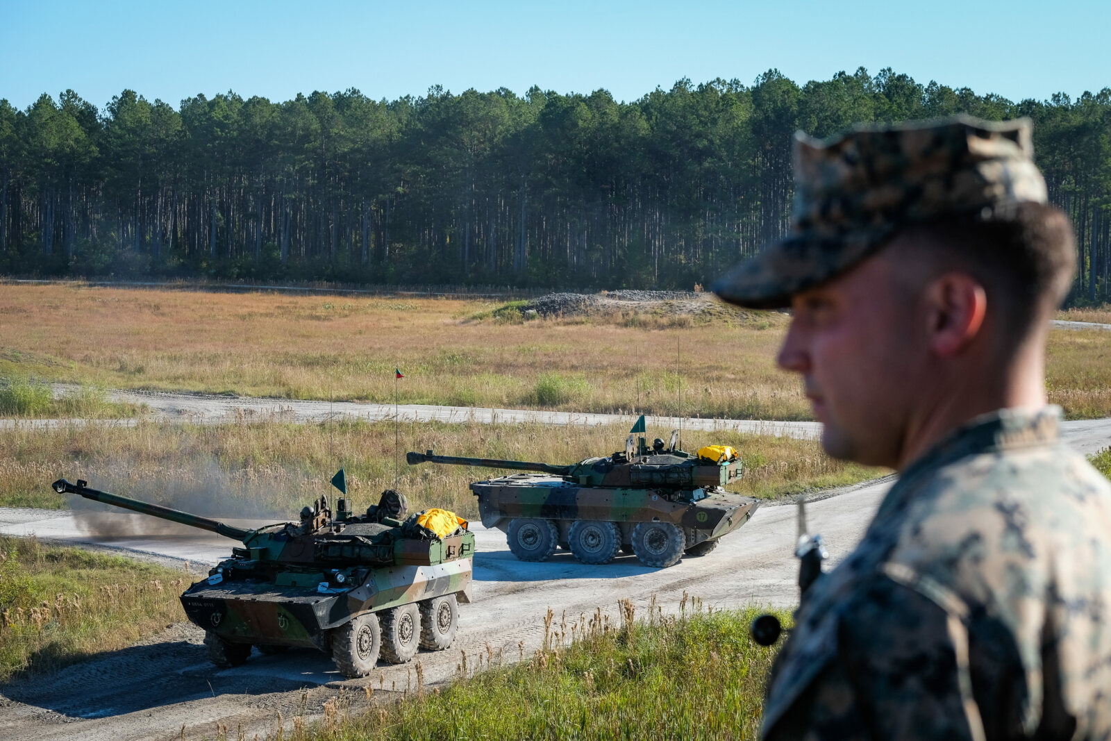 USA, Jacksonville, 2017-10-27. A US Marine with two driving tanks behind him during the Amphibious Bold Alligator Exerci