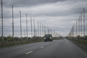 Ukraine, Pavlograd, 2026-04-24. Kilometres of netting strung on poles turn the supply roads of the Ukrainian rear into c
