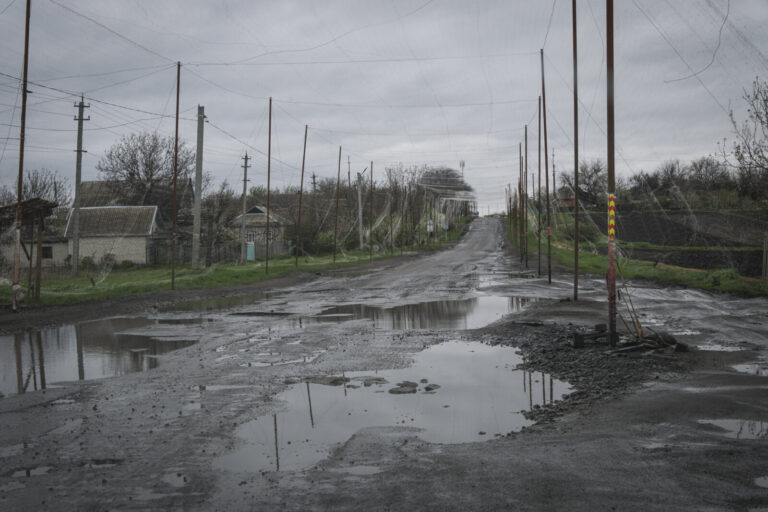 Ukraine, Pavlograd, 2026-04-24. Kilometres of netting strung on poles turn the supply roads of the Ukrainian rear into c