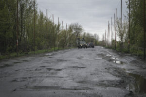 Ukraine, Pavlograd, 2026-04-24. Kilometres of netting strung on poles turn the supply roads of the Ukrainian rear into c