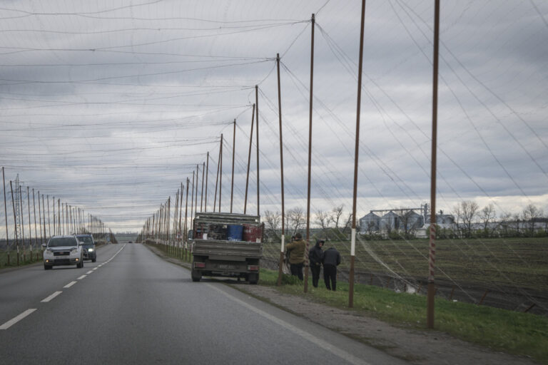 Ukraine, Pavlograd, 2026-04-24. Kilometres of netting strung on poles turn the supply roads of the Ukrainian rear into c