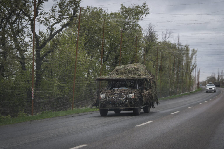 Ukraine, Pavlograd, 2026-04-24. Kilometres of netting strung on poles turn the supply roads of the Ukrainian rear into c