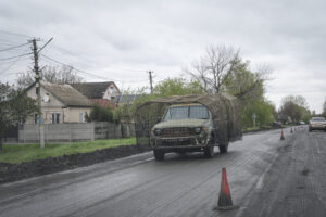 Ukraine, Pavlograd, 2026-04-24. Kilometres of netting strung on poles turn the supply roads of the Ukrainian rear into c