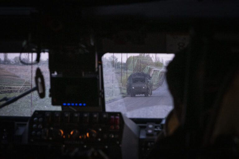 Ukraine, Pavlograd, 2026-04-25. Kilometres of netting strung on poles turn the supply roads of the Ukrainian rear into c